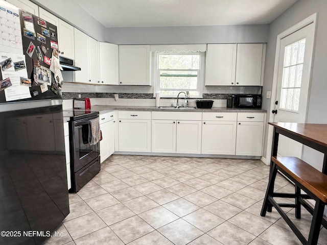 kitchen featuring a sink, white cabinets, ventilation hood, decorative backsplash, and black appliances