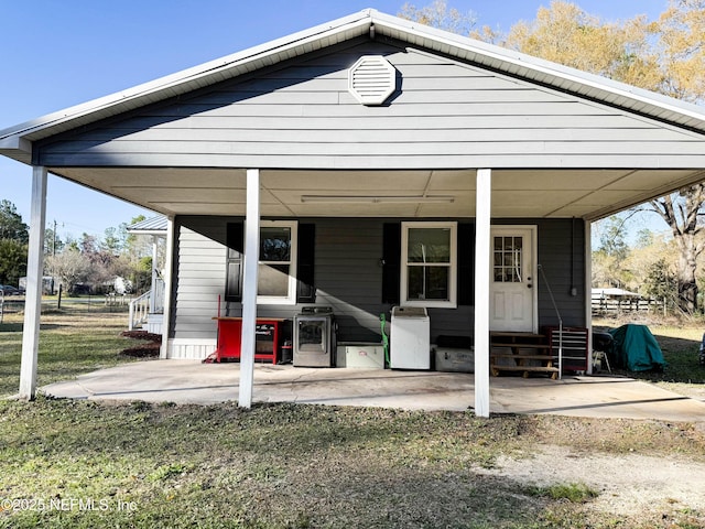 view of front of property with entry steps and a front lawn