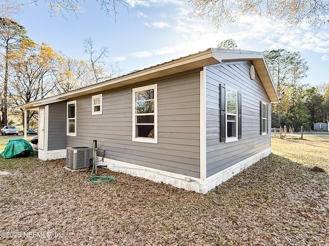 view of side of property featuring cooling unit