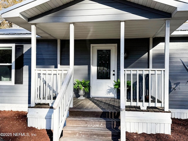 property entrance with covered porch