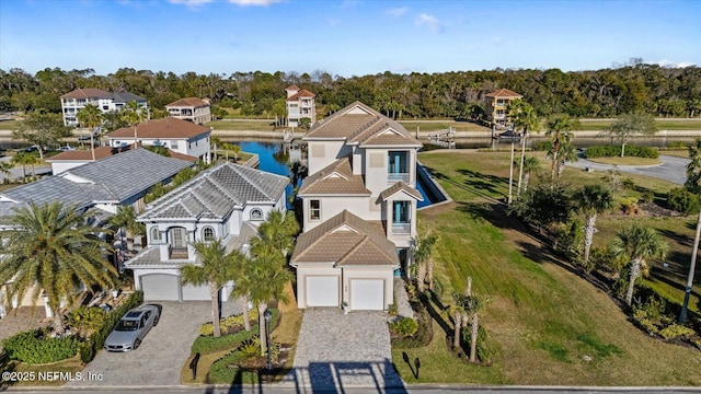 birds eye view of property with a residential view and a water view