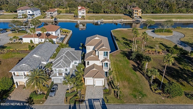 birds eye view of property with a residential view and a water view