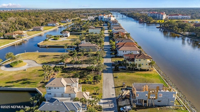 drone / aerial view with a residential view and a water view