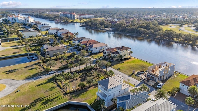 birds eye view of property with a residential view and a water view