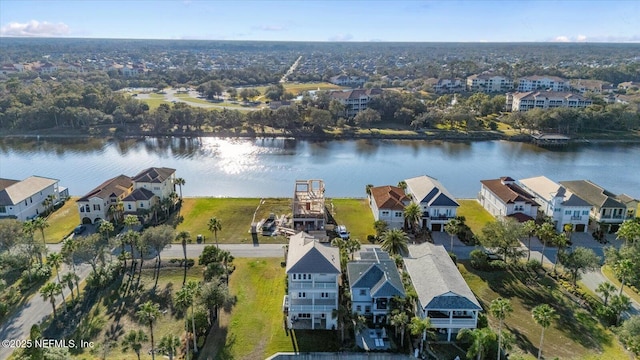 aerial view with a residential view and a water view