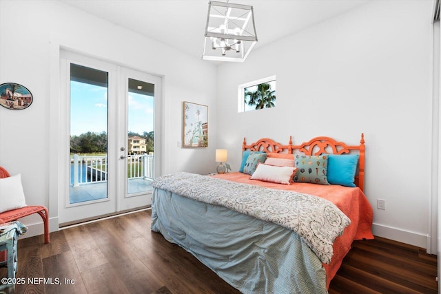 bedroom with access to outside, french doors, dark wood-style flooring, and baseboards