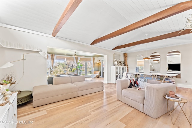 living room featuring vaulted ceiling with beams, light wood-style flooring, and baseboards