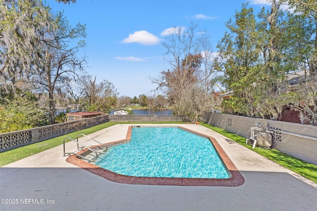 view of pool featuring a fenced in pool, a patio area, a water view, and a fenced backyard