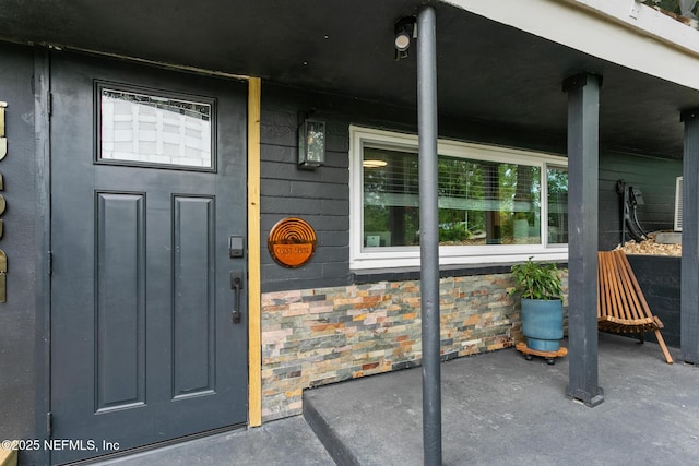 property entrance with covered porch