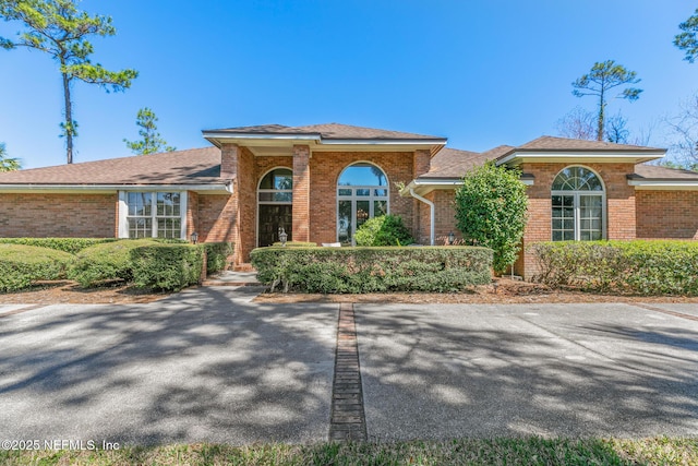 view of front of house featuring brick siding