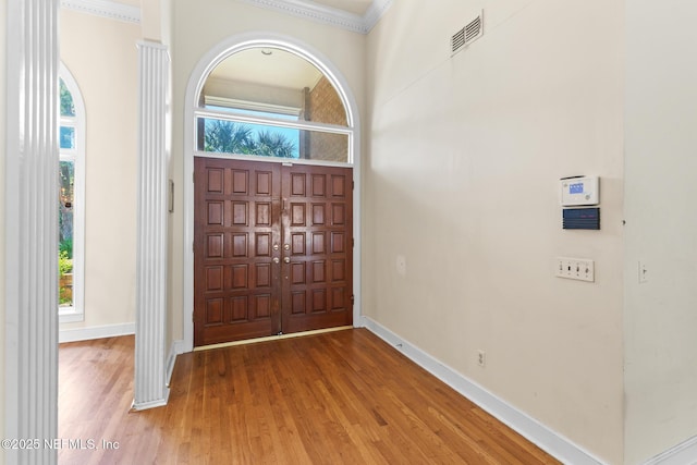 24620 Deer Trace Dr, Ponte Vedra Beach, FL 32082 - entrance foyer featuring crown molding, wood finished floors, visible vents, and baseboards