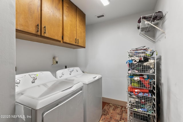 24620 Deer Trace Dr, Ponte Vedra Beach, FL 32082 - laundry area featuring visible vents, cabinet space, independent washer and dryer, and baseboards