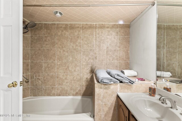 24620 Deer Trace Dr, Ponte Vedra Beach, FL 32082 - bathroom featuring tub / shower combination, vanity, and tile walls