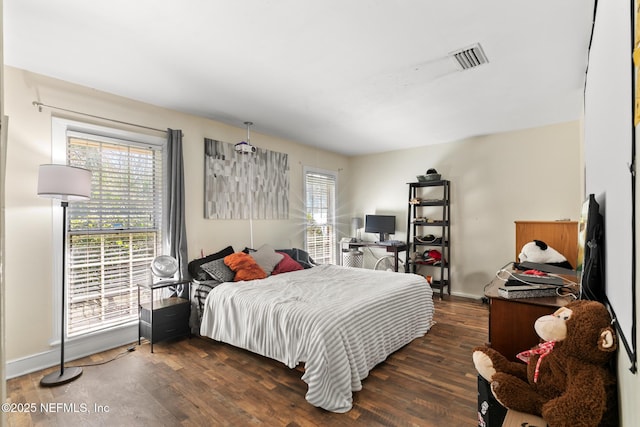 24620 Deer Trace Dr, Ponte Vedra Beach, FL 32082 - bedroom featuring visible vents, baseboards, and dark wood-style flooring
