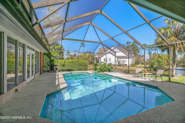 24620 Deer Trace Dr, Ponte Vedra Beach, FL 32082 - pool with a lanai, a patio area, and french doors