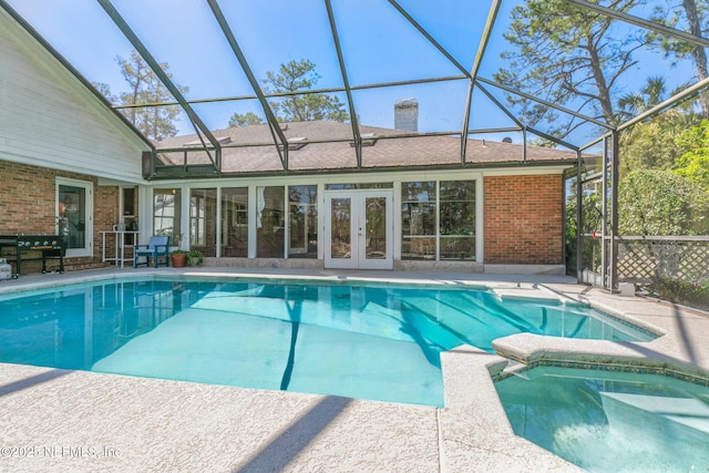 24620 Deer Trace Dr, Ponte Vedra Beach, FL 32082 - view of pool with glass enclosure, a patio area, french doors, and a pool with connected hot tub