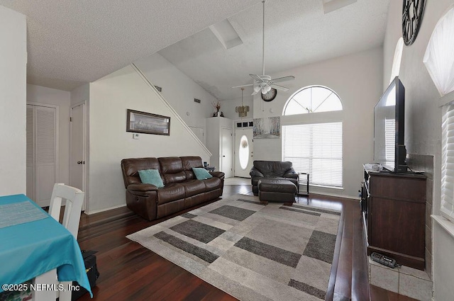 living room with a ceiling fan, a textured ceiling, wood finished floors, and high vaulted ceiling