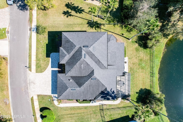 birds eye view of property featuring a water view