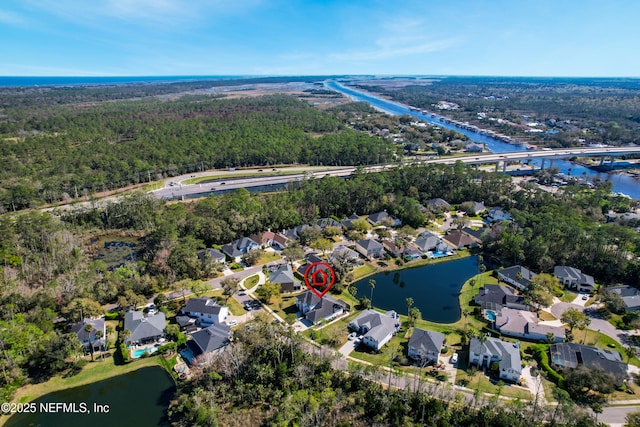 birds eye view of property featuring a residential view and a water view