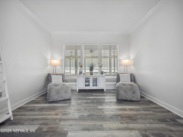 living area featuring crown molding, wood finished floors, and baseboards