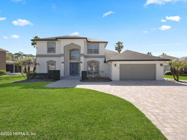 view of front of house featuring stucco siding, decorative driveway, roof with shingles, a front yard, and a garage