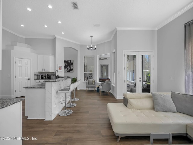 297 S Hampton Club Way, Saint Augustine, FL 32092 - kitchen featuring white cabinets, visible vents, a ceiling fan, stone counters, and open floor plan
