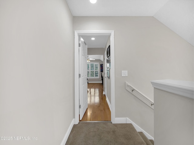 297 S Hampton Club Way, Saint Augustine, FL 32092 - hall featuring baseboards, lofted ceiling, an upstairs landing, and carpet flooring