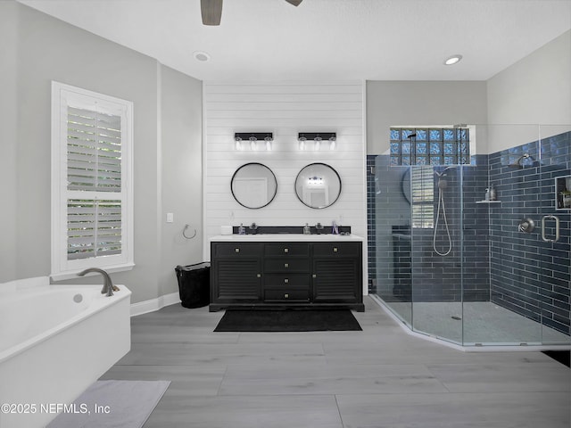 297 S Hampton Club Way, Saint Augustine, FL 32092 - full bath with a bath, a shower stall, double vanity, ceiling fan, and a sink