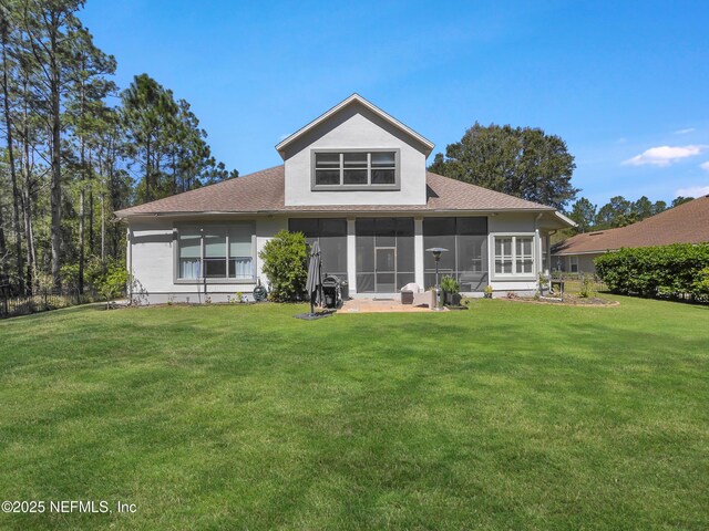 297 S Hampton Club Way, Saint Augustine, FL 32092 - rear view of property with a sunroom, a shingled roof, and a yard