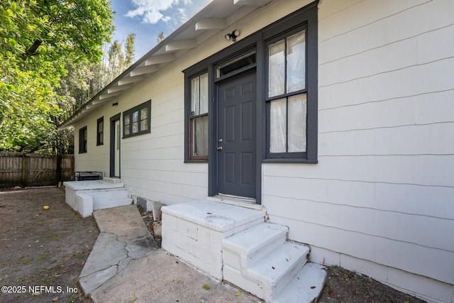 property entrance with fence