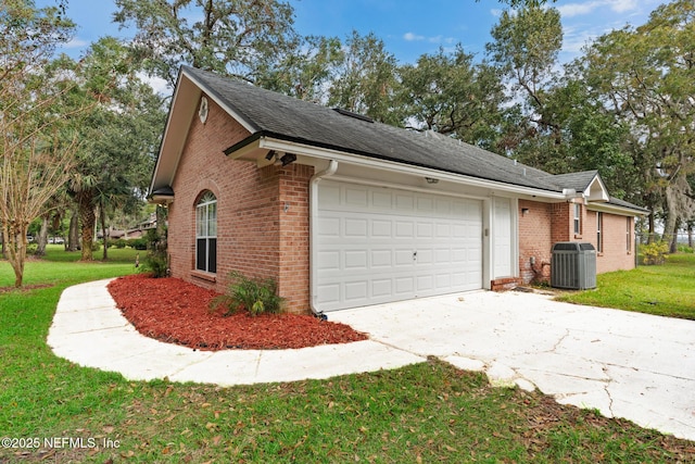 view of home's exterior with central air condition unit, an attached garage, a lawn, and brick siding