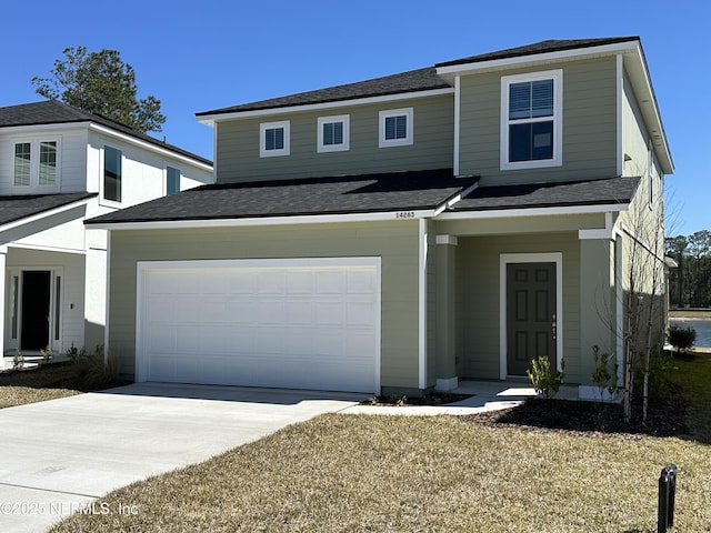 view of front of property with a garage, concrete driveway, and roof with shingles