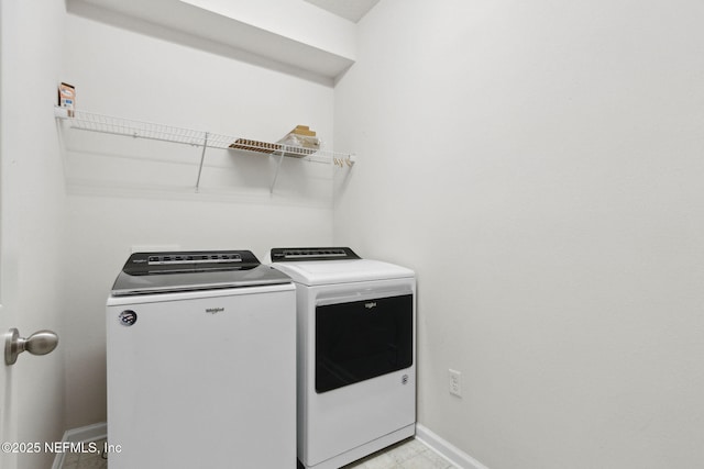 laundry room with laundry area, independent washer and dryer, and baseboards