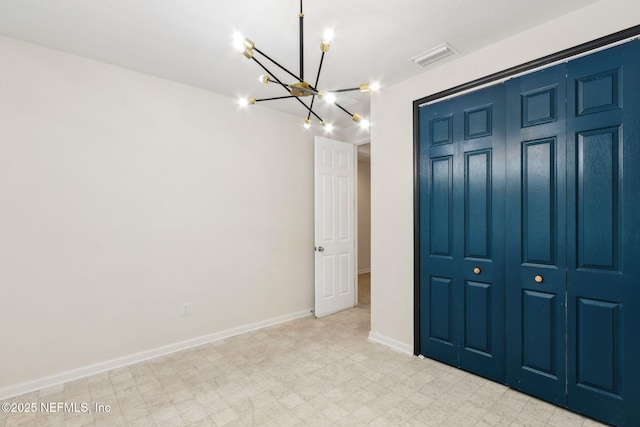 unfurnished bedroom with a chandelier, visible vents, baseboards, a closet, and light floors