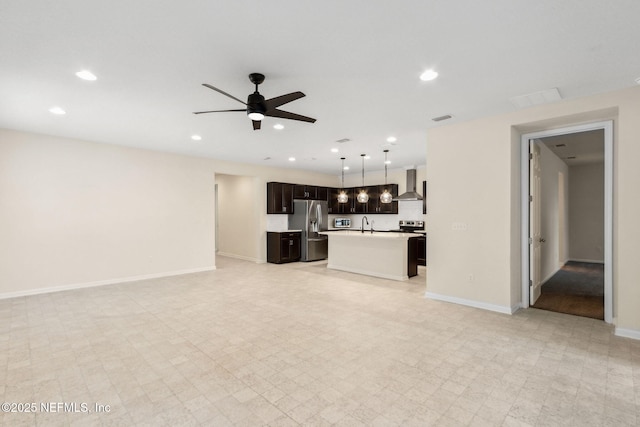 unfurnished living room with a ceiling fan, recessed lighting, visible vents, and baseboards