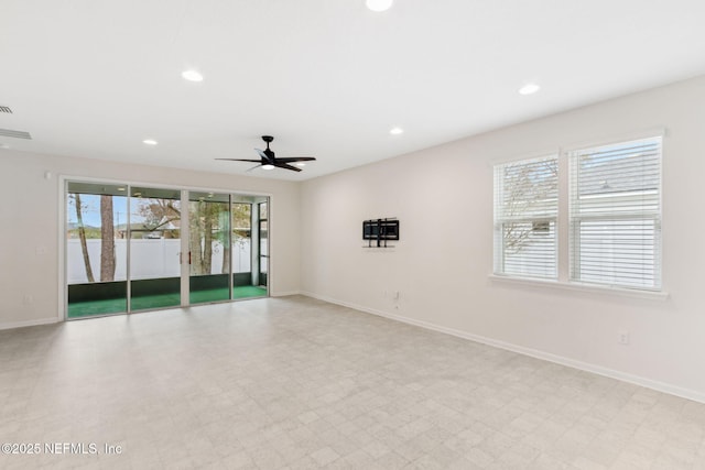 spare room with baseboards, light floors, a ceiling fan, and recessed lighting