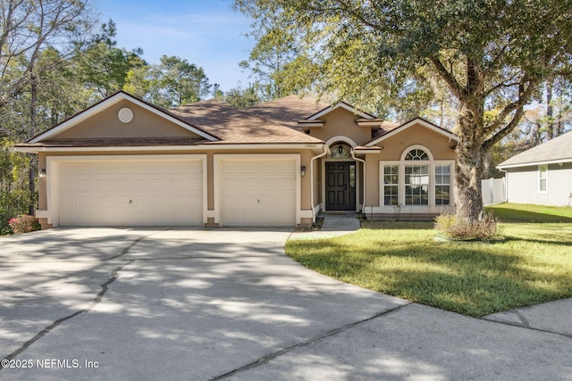 ranch-style house featuring roof with shingles, stucco siding, concrete driveway, a front yard, and a garage