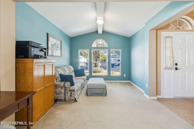 living area featuring carpet, lofted ceiling with beams, baseboards, and a textured ceiling