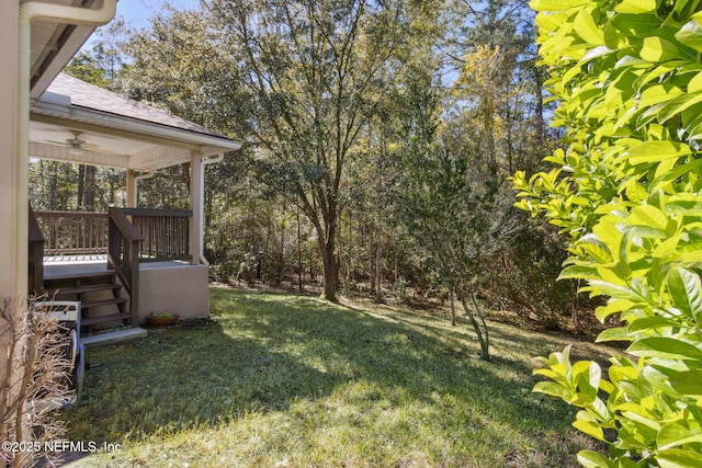 view of yard featuring ceiling fan