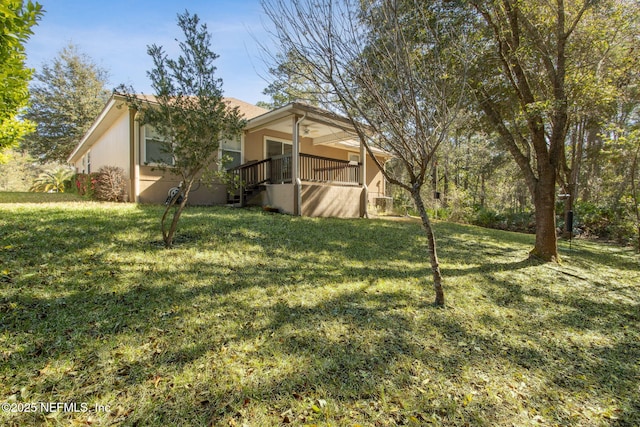 view of yard featuring covered porch