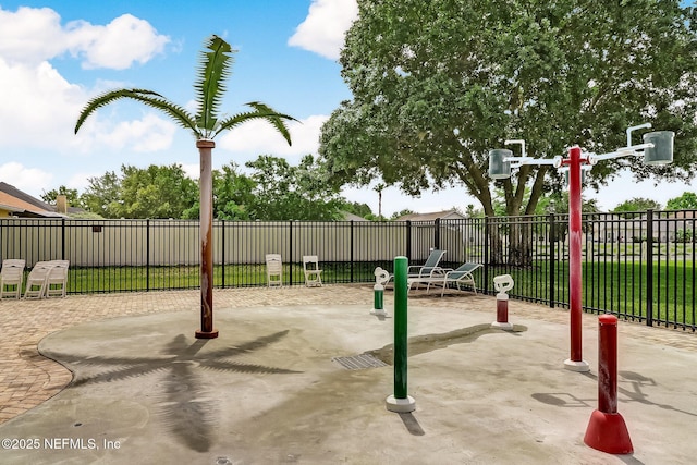 view of jungle gym with a patio area and fence