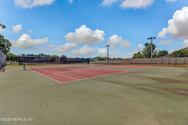 view of sport court featuring community basketball court and fence