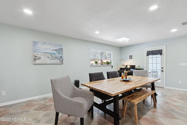 17524 Eagle Bend Blvd, Jacksonville, FL 32226 - dining room featuring recessed lighting, visible vents, a textured ceiling, and baseboards