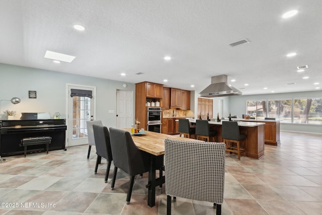 17524 Eagle Bend Blvd, Jacksonville, FL 32226 - dining room with recessed lighting, visible vents, a textured ceiling, and light tile patterned flooring