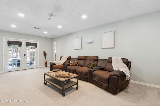 17524 Eagle Bend Blvd, Jacksonville, FL 32226 - living room with visible vents, french doors, light colored carpet, and a textured ceiling