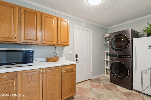 17524 Eagle Bend Blvd, Jacksonville, FL 32226 - laundry area with stacked washer and dryer, laundry area, a textured ceiling, and ornamental molding