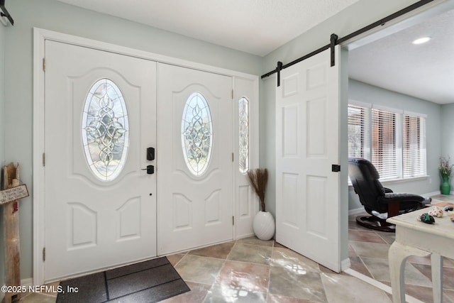 17524 Eagle Bend Blvd, Jacksonville, FL 32226 - foyer featuring a barn door and baseboards