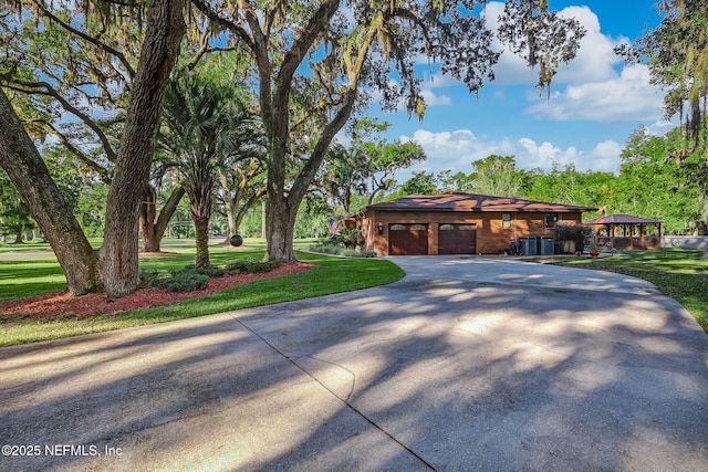 17524 Eagle Bend Blvd, Jacksonville, FL 32226 - view of front of home with a front yard, concrete driveway, and an attached garage