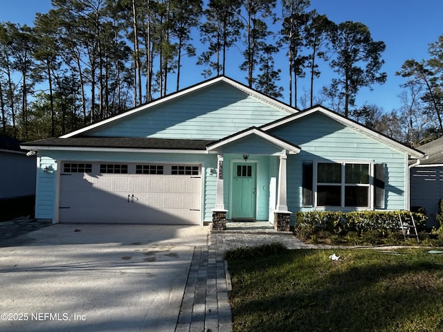 ranch-style home featuring driveway and a garage