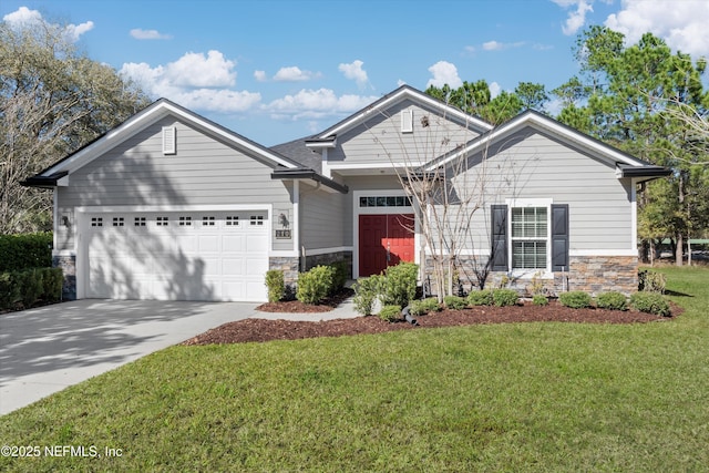 view of front of house featuring a garage, stone siding, a front yard, and driveway